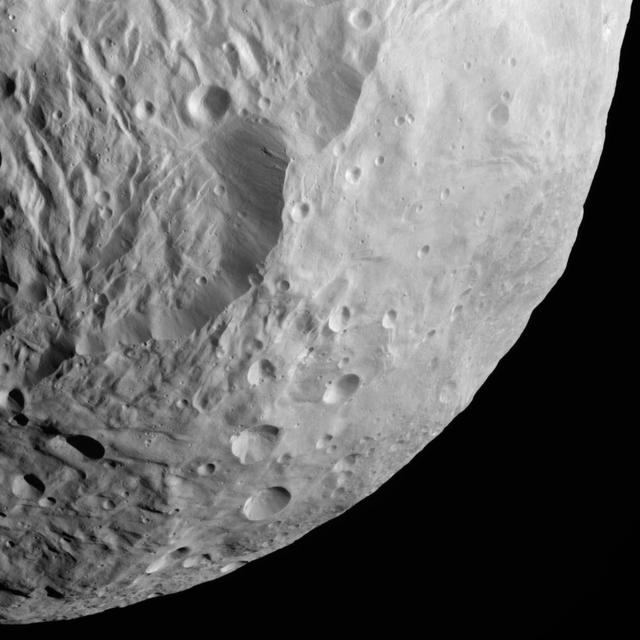 NASA Dawn spacecraft obtained this image of terrestrial mountains on asteroid Vesta with its framing camera on Aug. 26, 2011. The image has a resolution of about 260 meters per pixel.