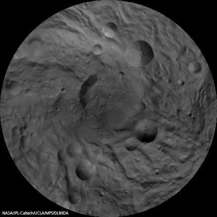 This image mosaic of Vesta south pole is generated from dozens of individual images from the framing camera aboard NASA Dawn spacecraft. This view is centered on the asteroid south pole, which is surrounded by several large impact craters.