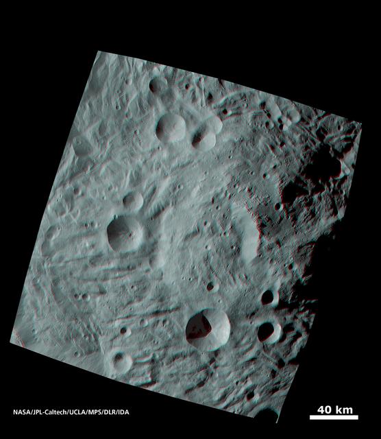 NASA image: Vesta Surface in 3-D: A Big Mountain at the Asteroid South Pole