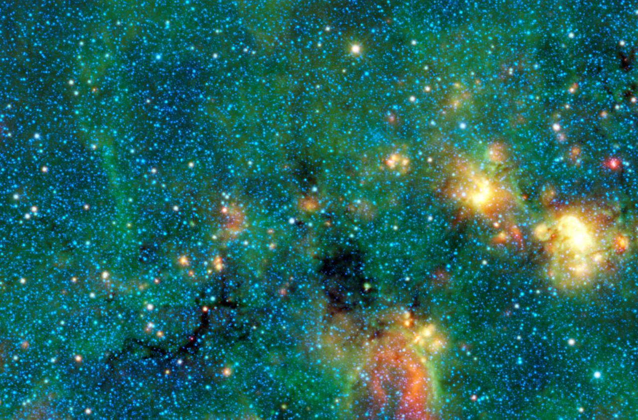 This infrared image from NASA Wide-field Infrared Survey Explorer shows exceptionally cold, dense cloud cores seen in silhouette against the bright diffuse infrared glow of the plane of the Milky Way galaxy.