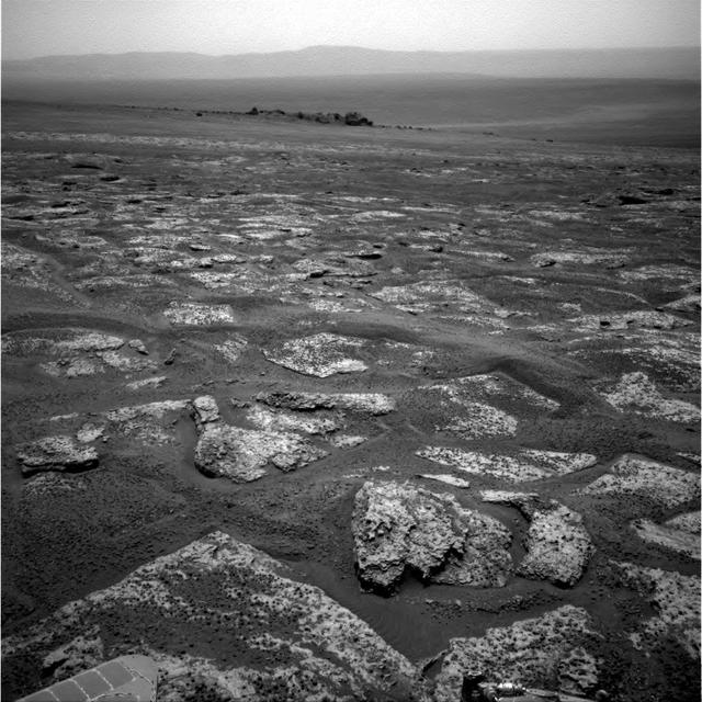 This image from the navigation camera on NASA Mars Exploration Rover Opportunity shows the view ahead on the day before the rover reached the rim of Endeavour crater. It was taken during the 2,680th Martian day, or sol, of the rover work on Mars.