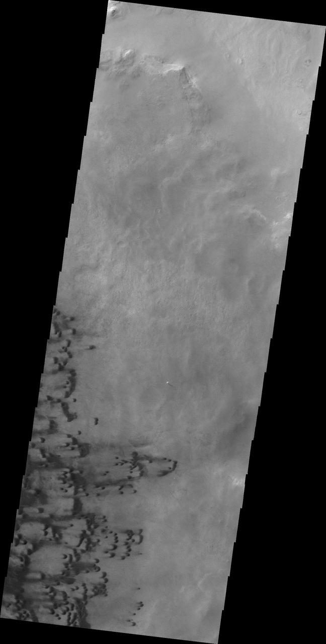 Small dunes are located on the floor of Darwin Crater as shown in this image from NASA 2001 Mars Odyssey spacecraft.