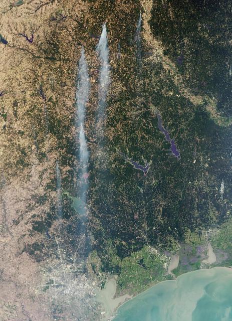 As the remains of Tropical Storm Lee passed over Louisiana on Monday, Sept. 5, 2011, strong, gusty winds on the western side of the storm stoked fires throughout eastern Texas as seen in this image from NASA Terra spacecraft.