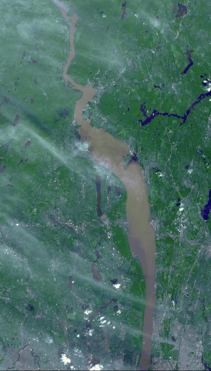 Brown and tan muddy water flows down the Hudson River are seen in this image acquired by NASA Terra spacecraft on Sept. 1, 2011. After the torrential rains from Hurricane Irene, many rivers in the eastern United States were filled with sediment.