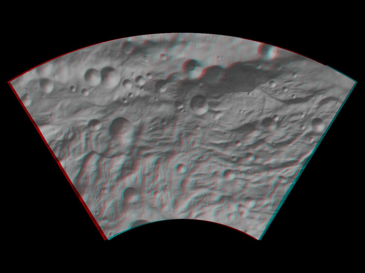 This anaglyph image shows the topography of asteroid Vesta southwestern region. The large, heavily degraded subdued rimmed crater in the top right becomes clearer in this anaglyph image. You need 3D glasses to view this image.