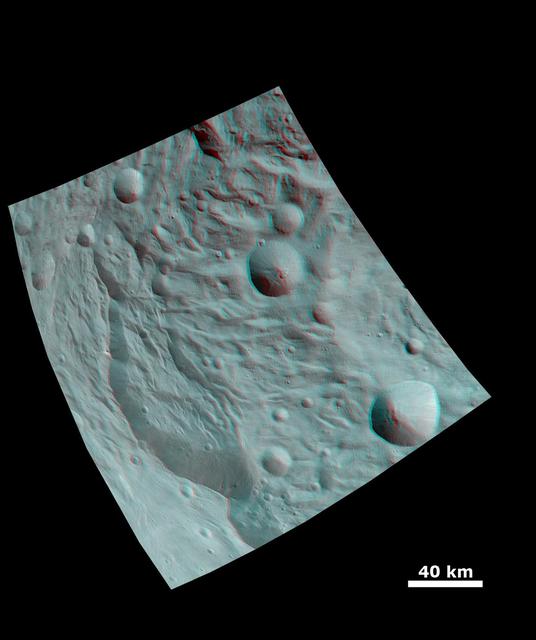 NASA image: Anaglyph Image of a Large Scarp in Vesta South Polar Region