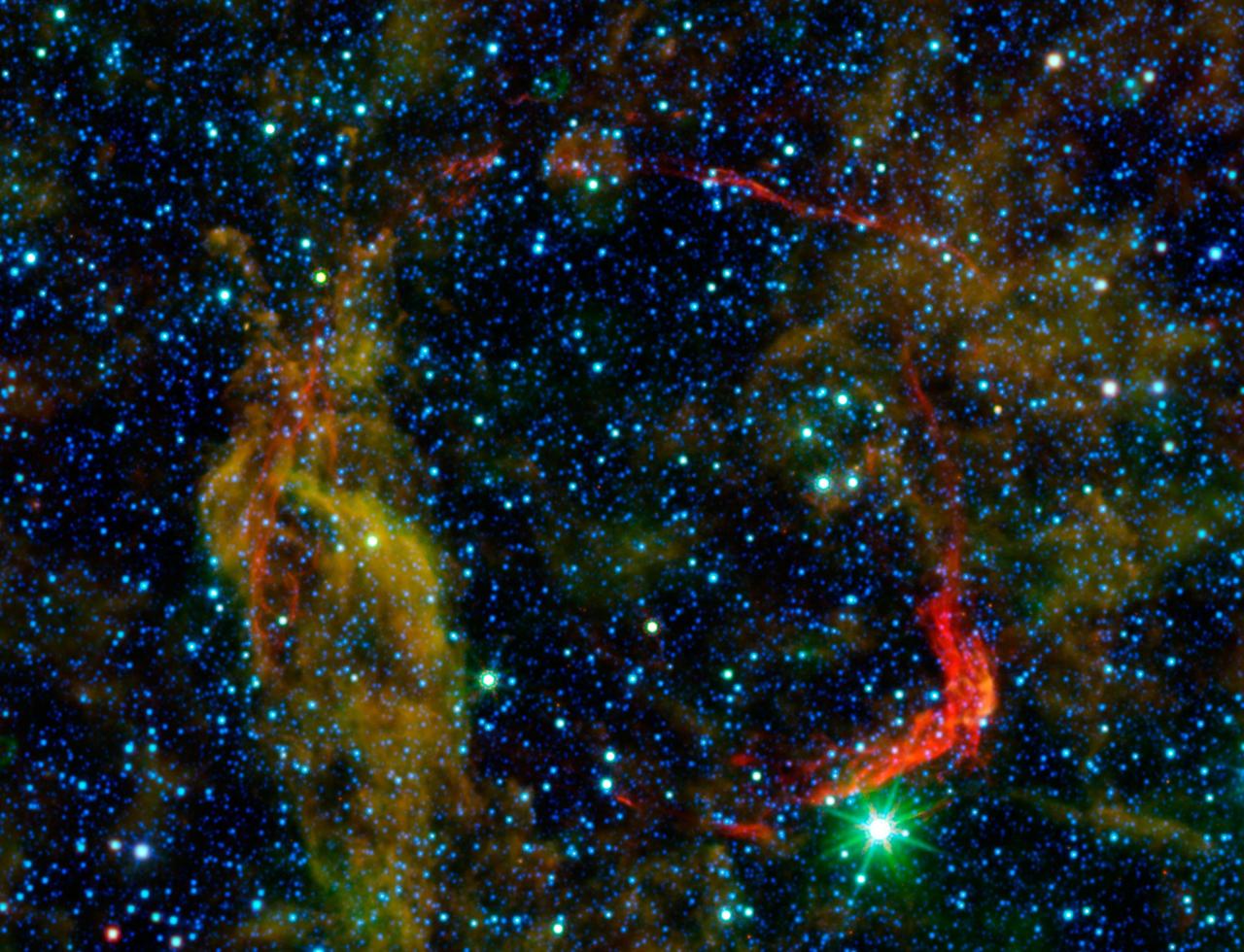 Infrared images from NASA Spitzer Space Telescope and Wide-field Infrared Survey Explorer are combined in this image of RCW 86, the dusty remains of the oldest documented example of an exploding star, or supernova.