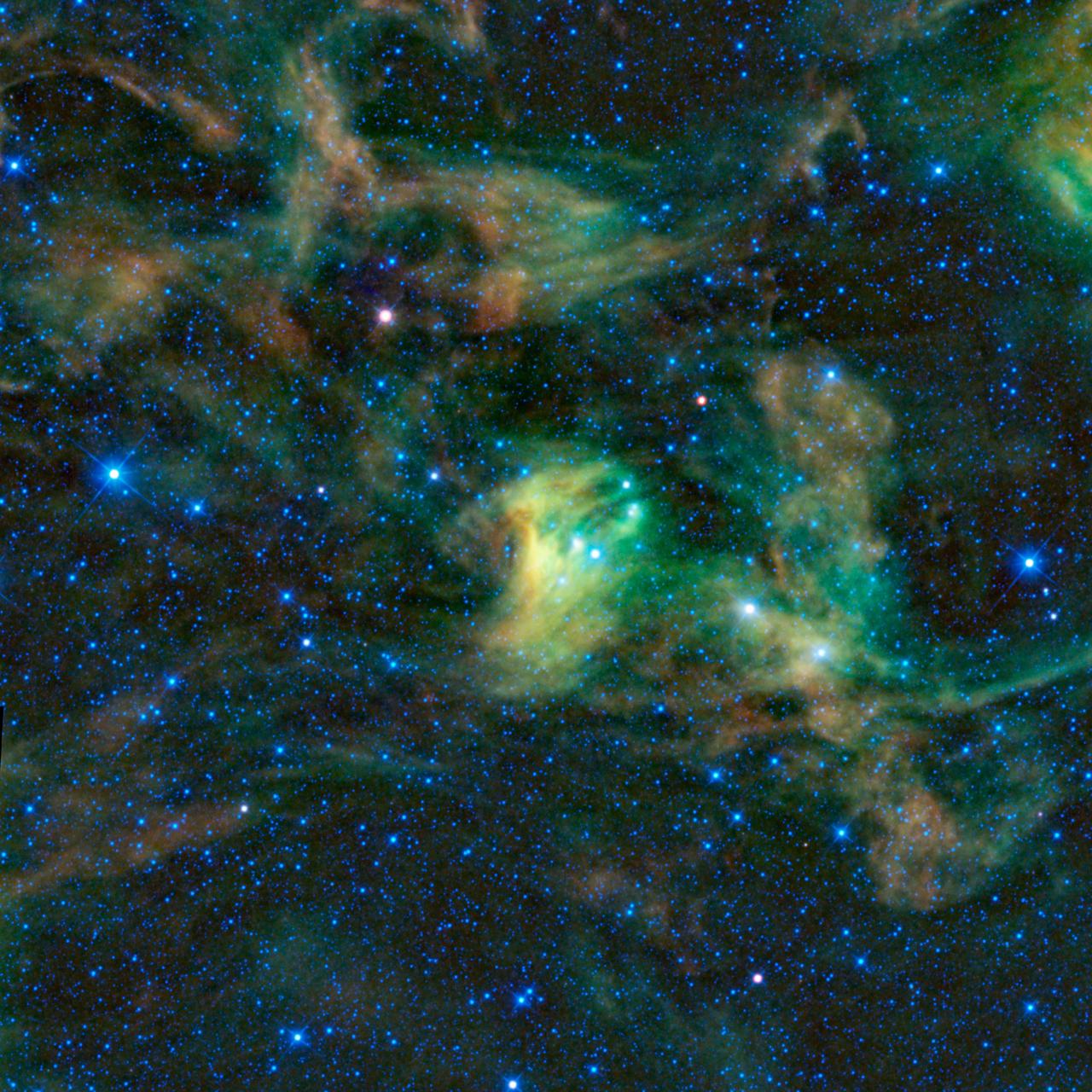 Between the claws of the dreaded scorpion imagined by the ancient Greeks lies this giant dust cloud, imaged by the Wide-field Infrared Survey Explorer. The constellation of Scorpius is prominent in the summer night sky in North America.