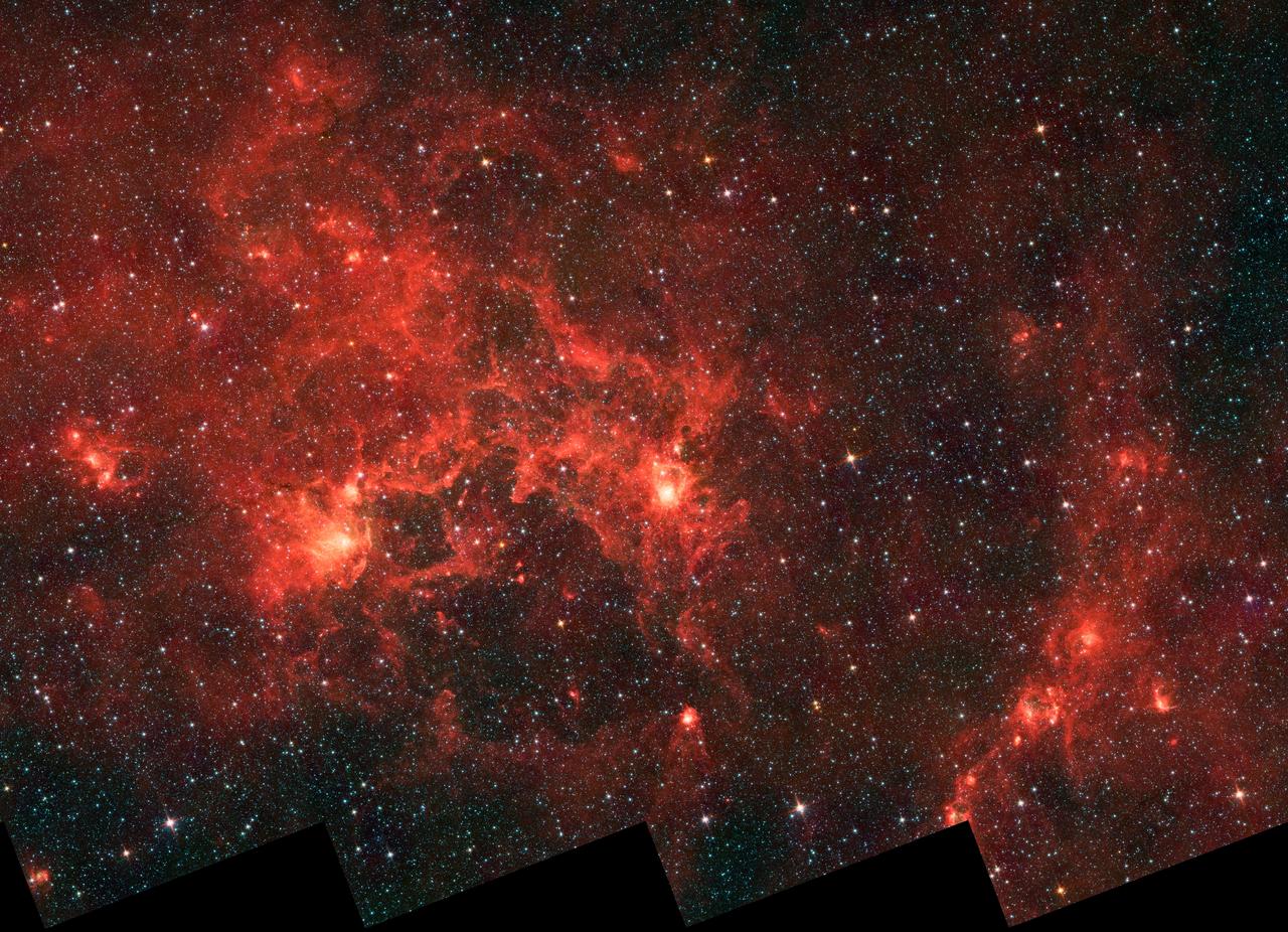 This infrared image from NASA Spitzer Space Telescope shows the nebula nicknamed the Dragonfish. This turbulent region, jam-packed with stars, is home to some of the most luminous massive stars in our Milky Way galaxy.