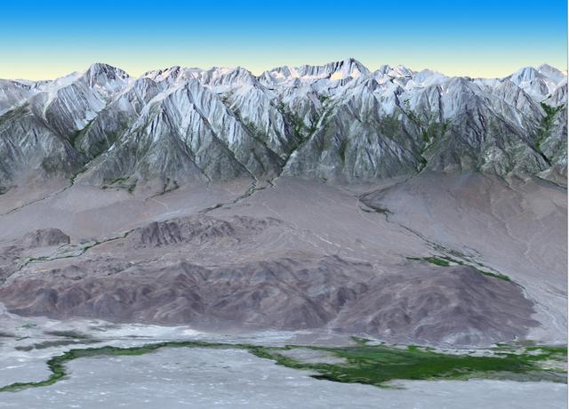At 14,505 feet high, Mt. Whitney, the highest point in the contiguous U.S., is located in California Sierra Nevada Mountains, on the west side of Owens Valley. The Alabama Hills appear in the foreground of this image from NASA Terra spacecraft.