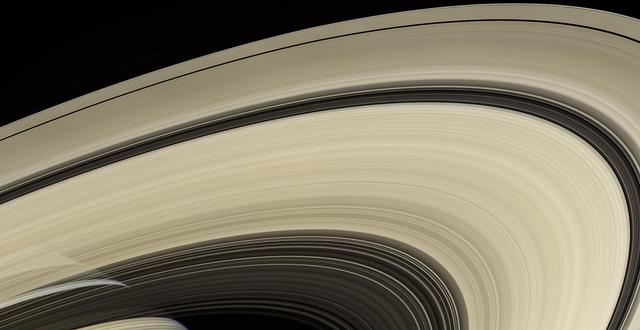 Saturn's rings are perhaps the most recognized feature of any world in our solar system. Cassini spent more than a decade examining them more closely than any spacecraft before it. The rings are made mostly of particles of water ice that range in size from smaller than a grain of sand to as large as mountains. The ring system extends up to 175,000 miles (282,000 kilometers) from the planet, but for all their immense width, the rings are razor-thin, about 30 feet (10 meters) thick in most places. From the right angle you can see straight through the rings, as in this natural-color view that looks from south to north. Cassini obtained the images that comprise this mosaic on April 25, 2007, at a distance of approximately 450,000 miles (725,000 kilometers) from Saturn. The Cassini spacecraft ended its mission on Sept. 15, 2017. https://photojournal.jpl.nasa.gov/catalog/PIA14943