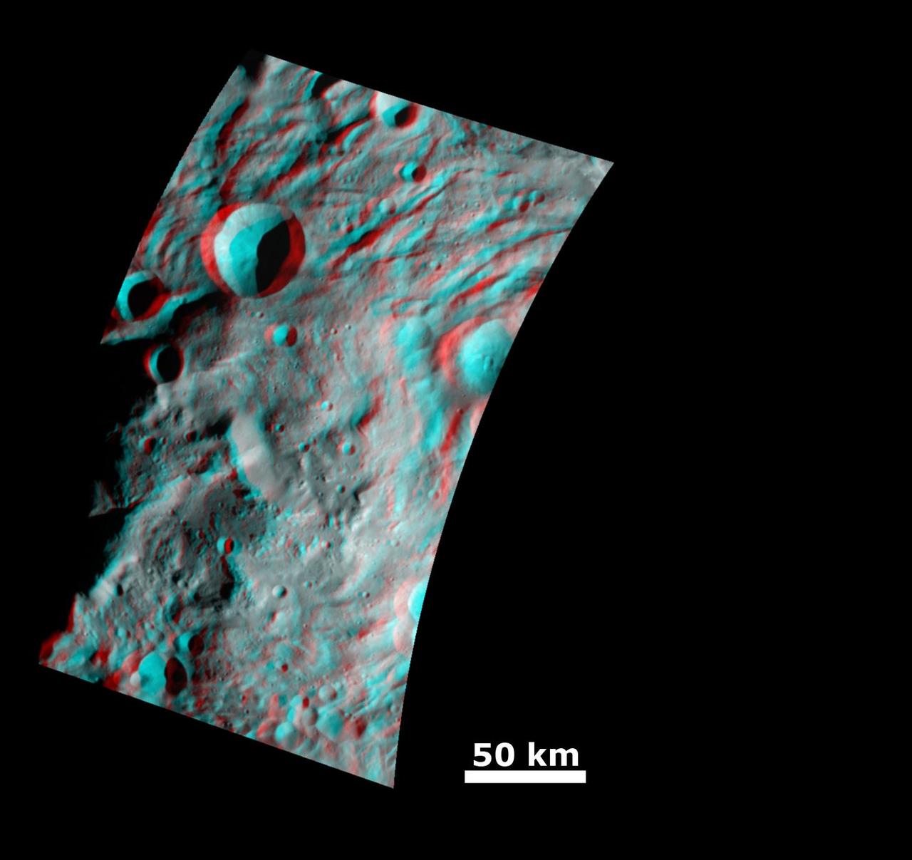 This anaglyph image from NASA Dawn spacecraft shows the topography of the mountain-central complex in asteroid Vesta south polar region. You need 3D glasses to view this image.