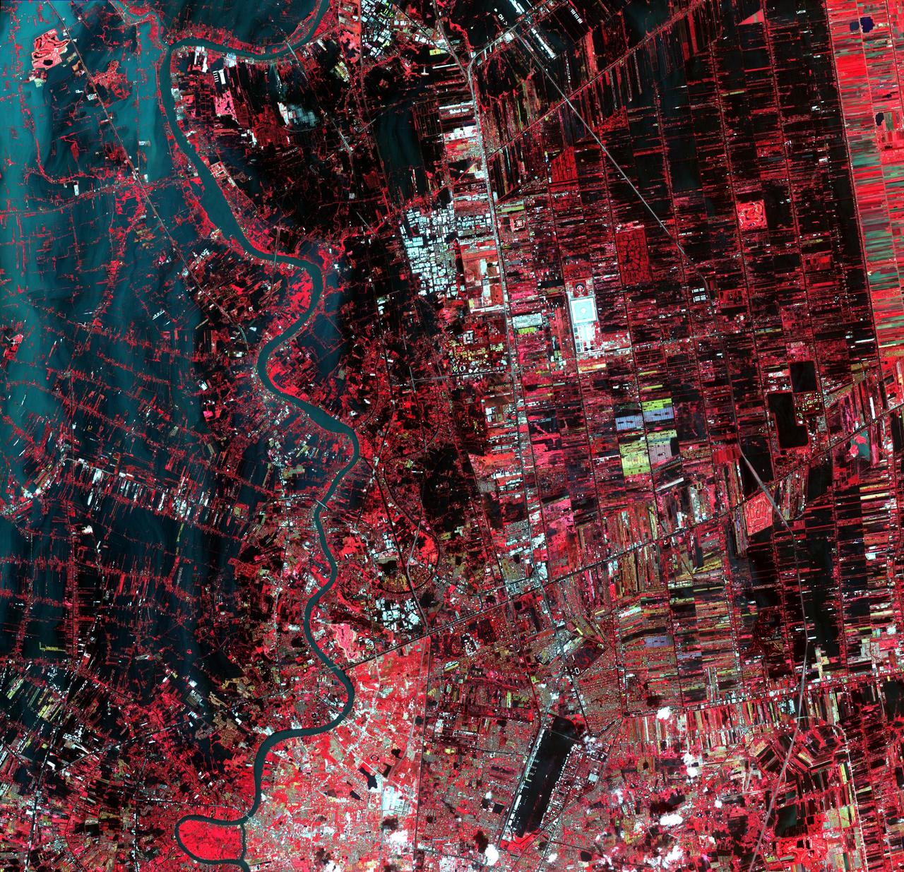 Flooding from the Chao Phraya River, Thailand, had begun to ebb in this image acquired by NASA Terra spacecraft on Nov. 1, 2011. Here, in blue-gray is the muddy water that had overflowed the banks of the river, flooding agricultural fields and villages.