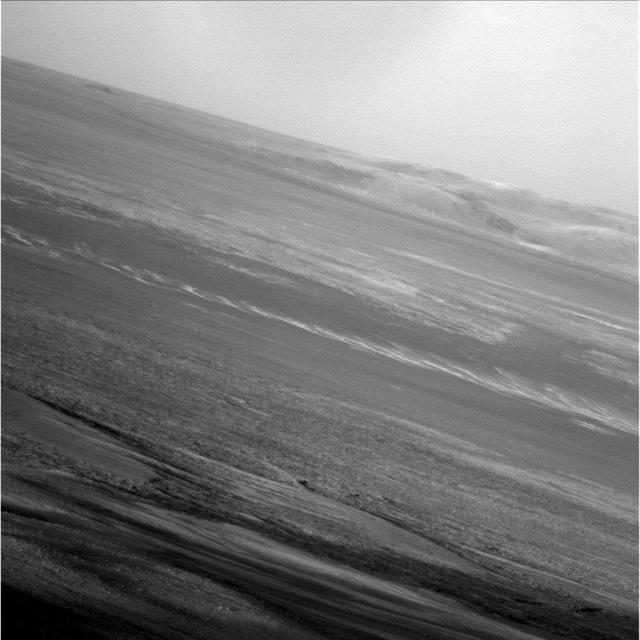 NASA Mars Exploration Rover Opportunity captured this low-light raw image during the late afternoon of the rover 2,847th Martian sol Jan. 27, 2012. The rover is positioned for the Mars winter at Greeley Haven.
