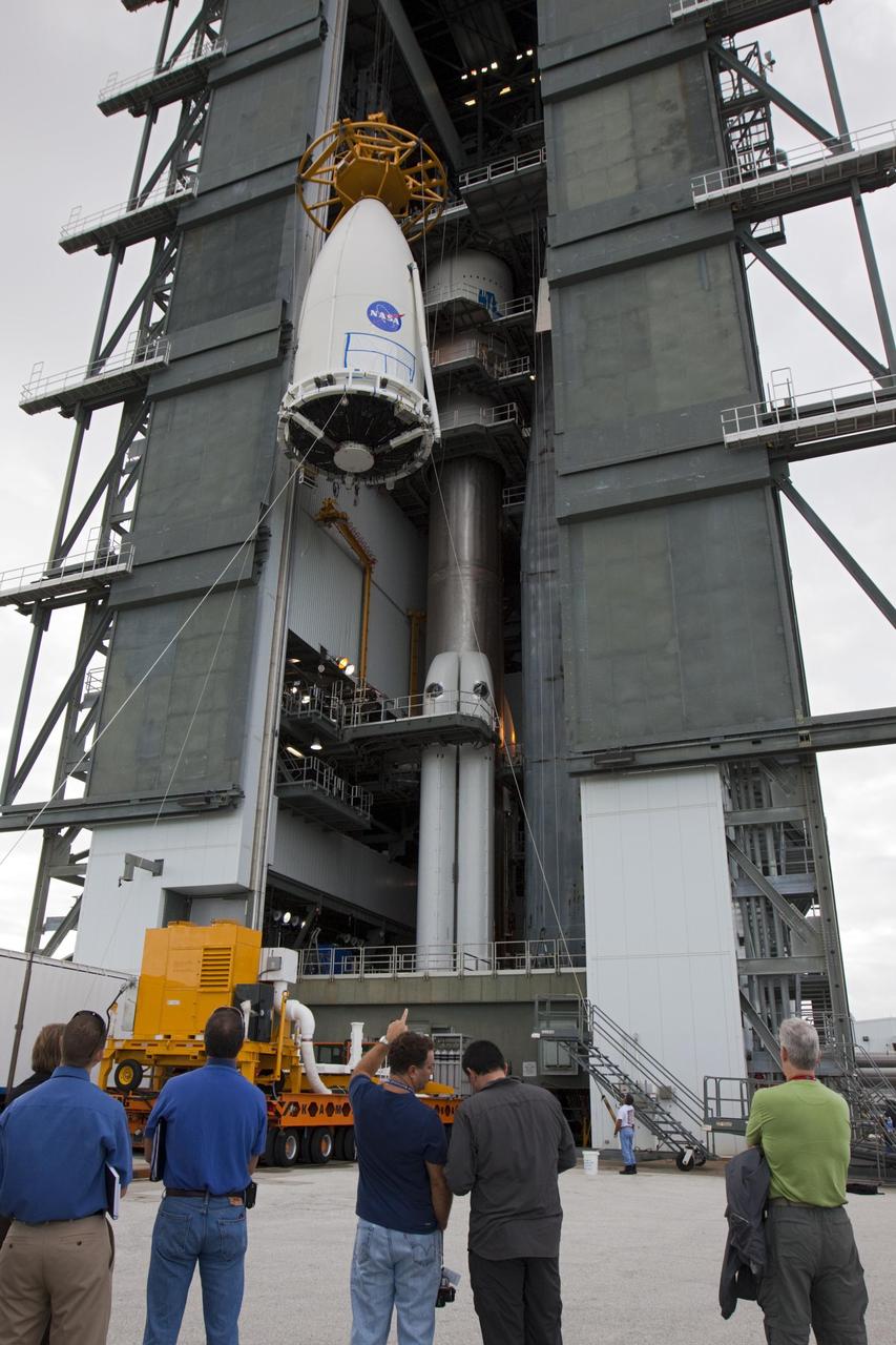 Employees at Space Launch Complex 41 of Cape Canaveral Air Force Station, Fla., keep watch as the payload fairing containing NASA Mars Science Laboratory spacecraft is lifted up the side of the Vertical Integration Facility on Nov. 3, 2011.