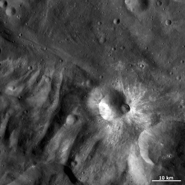 This image from NASA Dawn spacecraft is dominated by bright rayed craters of different sizes. The most prominent bright rayed crater is named Tuccia.