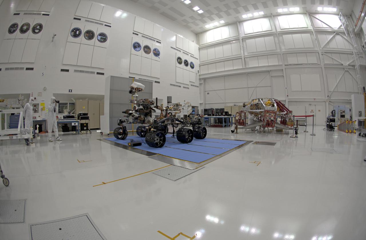 Right-eye view of NASA Curiosity rover and its powered descent vehicle pose for photographs prior to being integrated for launch at JPL Spacecraft Assembly Facility.