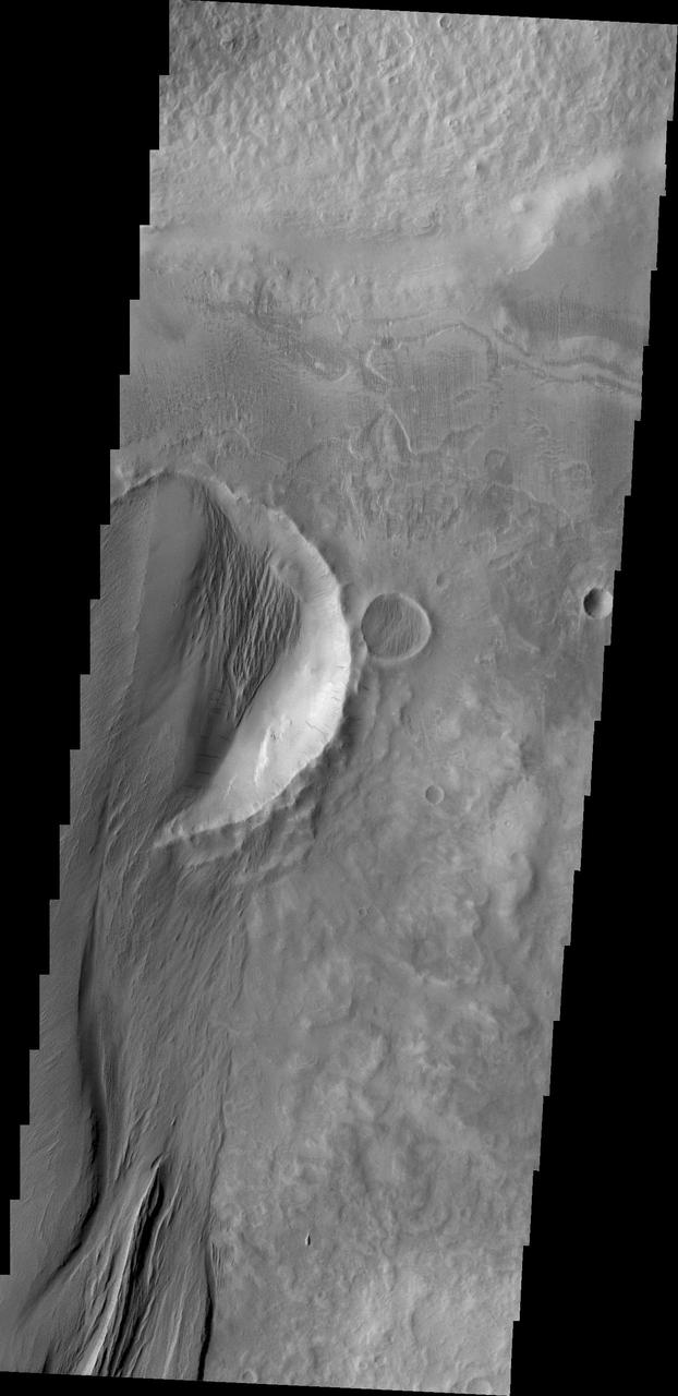 The power of the wind is undeniable in this image of the surface of Mars as seen by NASA 2001 Mars Odyssey spacecraft. 