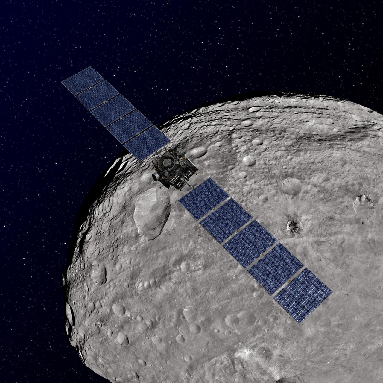 This artist concept shows NASA Dawn spacecraft orbiting the giant asteroid Vesta. The depiction of Vesta is based on images obtained by Dawn framing cameras.