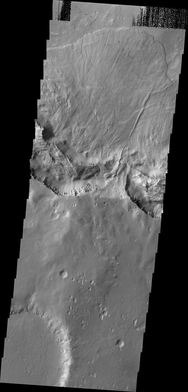 This large landslide deposit is located in an unnamed crater southwest of Holden Crater. This image was captured by NASA 2001 Mars Odyssey spacecraft.