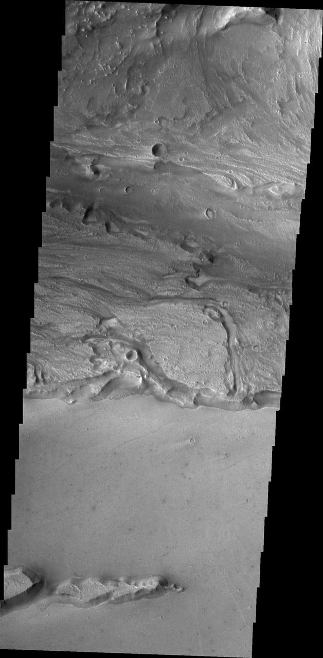 This image from NASA 2001 Mars Odyssey spacecraftshows a small portion of Kasei Valles, one of the largest channel systems on Mars.