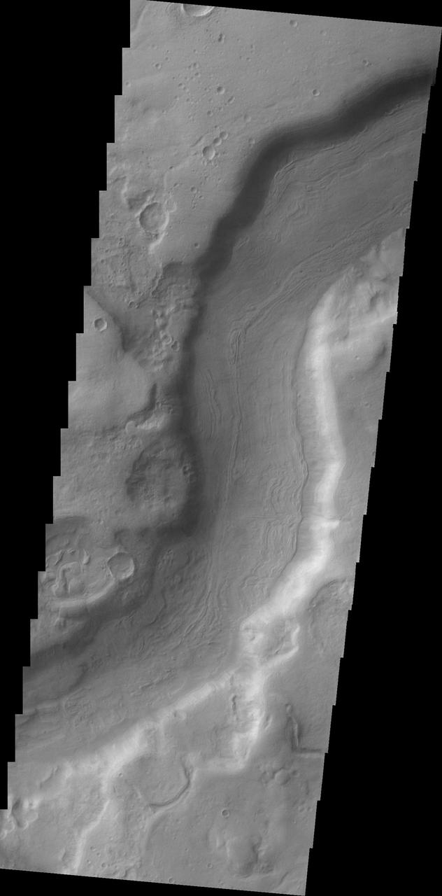 A small section of Dao Vallis in shown in this image from NASA 2001 Mars Odyssey spacecraft. Dao Vallis is a major channel that drains into Hellas Planitia.