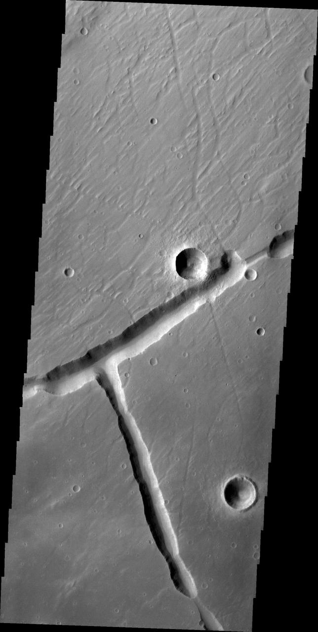 Right angles are not common in nature. They are almost always formed by tectonic forces. This right angle on Mars is part of Sacra Fossae. This image is from NASA 2001 Mars Odyssey spacecraft.