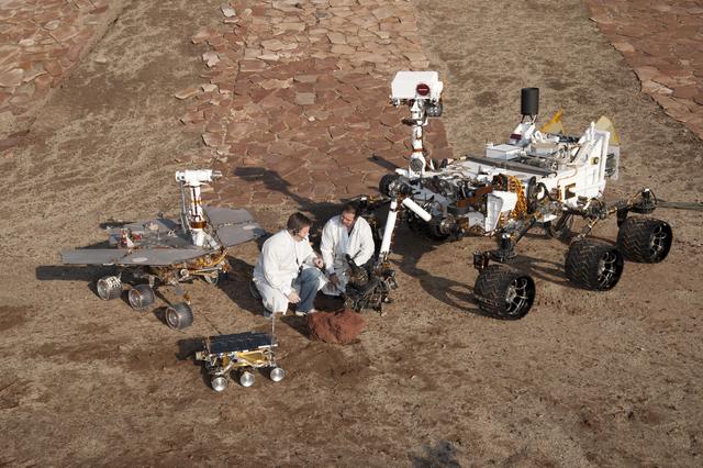 NASA image: Three Generations of Rovers with Crouching Engineers