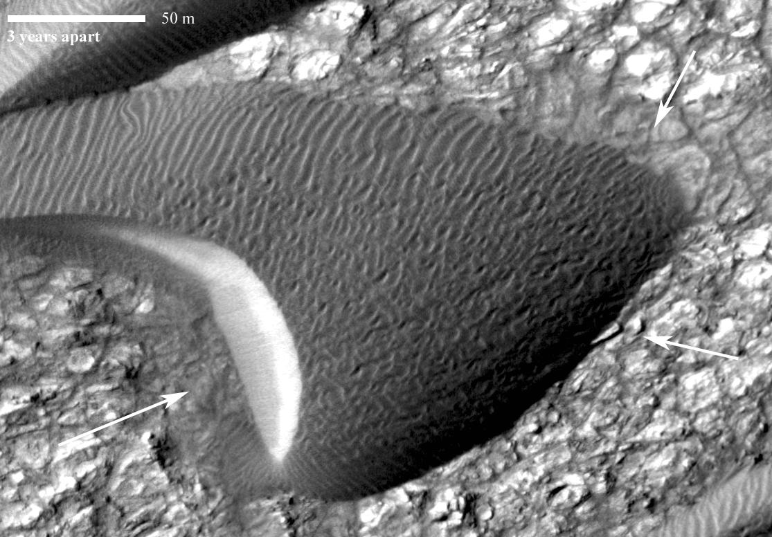 This image, from an animation from NASA Mars Reconnaissance Orbiter shows a dark, rippled sand dune overlying bright-toned rock.