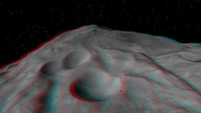 This anaglyph shows the central complex in asteroid Vesta Rheasilvia impact basin. The central complex about two and a half times taller than Mt. Everest. You need 3-D glasses to view this image.