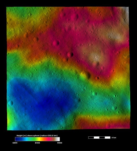 This image from NASA Dawn spacecraft, is based on a framing camera image that is overlain by a color-coded height representation of topography. This heart-shaped hollow is roughly 10 kilometers 6 miles across at its widest point.