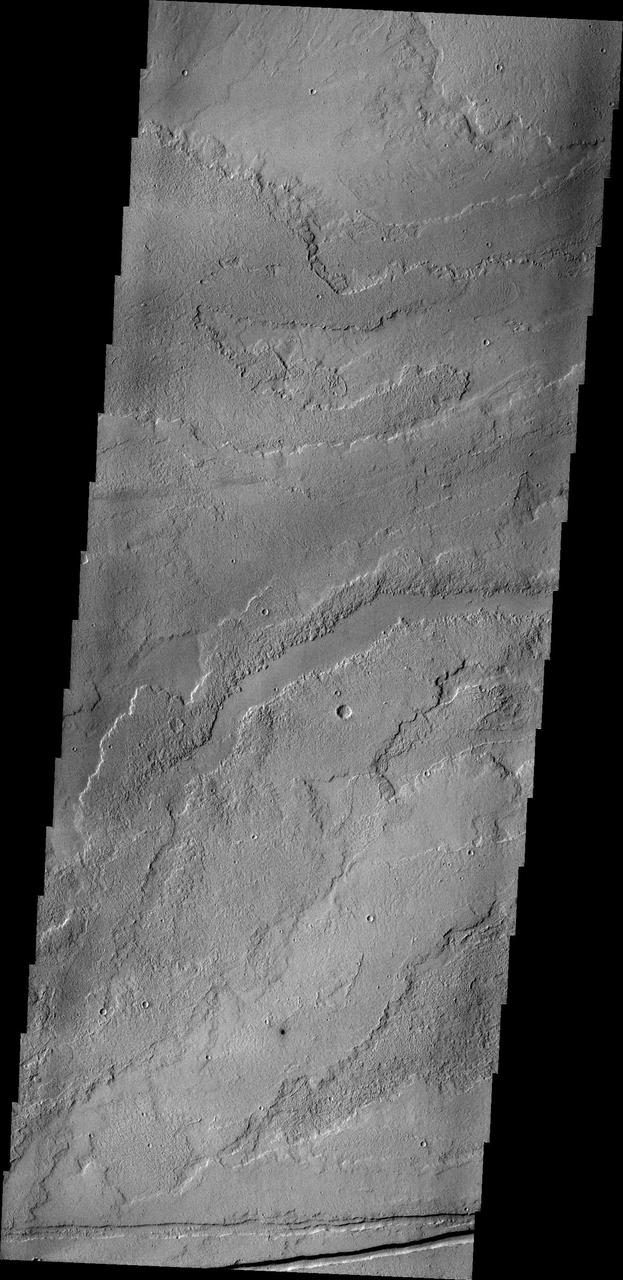 This image from NASA 2001 Mars Odyssey spacecraft shows a small portion of the vast lava flow fields between Echus Chasma and the main Tharsis volcanoes.