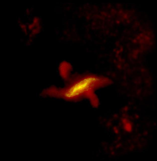 This parallelogram shaped region of dust observed by ESA Herschel Space telescope can be best described using galaxy formation models where a flat spiral galaxy collides with an elliptical galaxy becoming warped in the process.