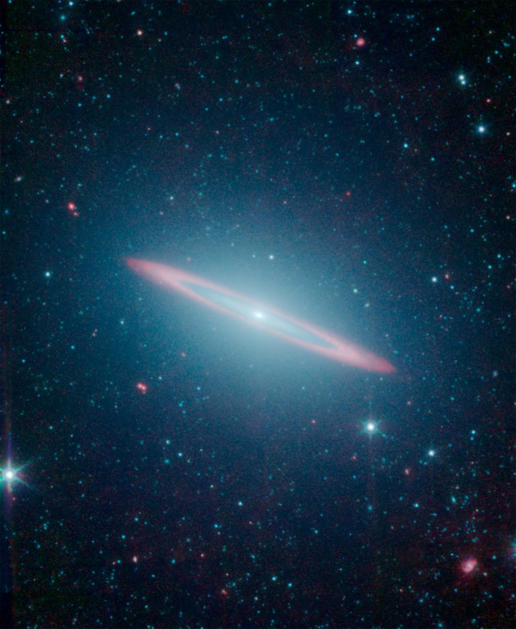 This infrared vision of NASA Spitzer Space Telescope has revealed that the Sombrero galaxy, named after its appearance in visible light to a wide-brimmed hat, is in fact two galaxies in one.