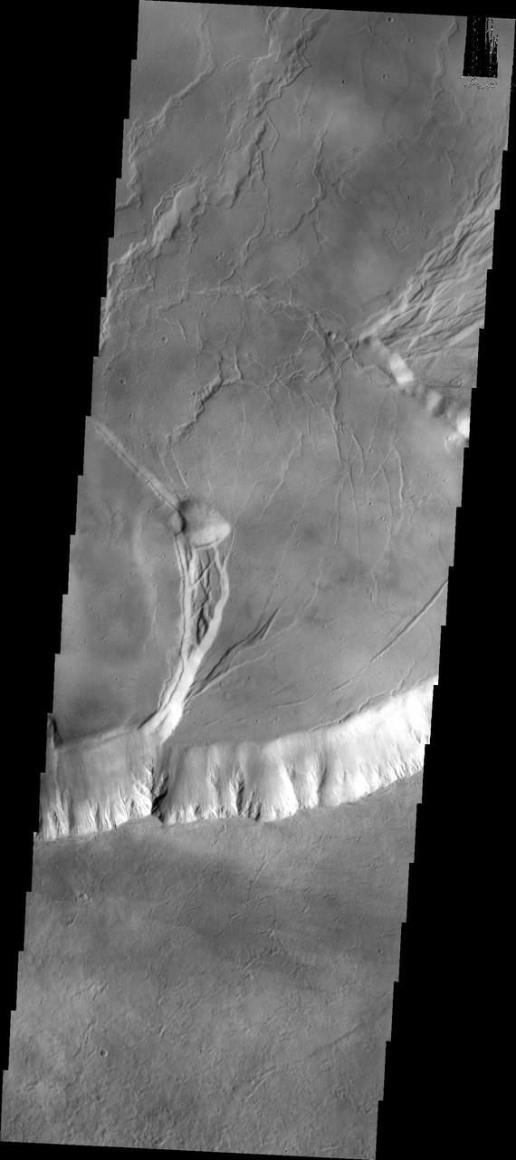 This image captured by NASA 2001 Mars Odyssey spacecraft shows part of the caldera system on the summit of Olympus Mons.