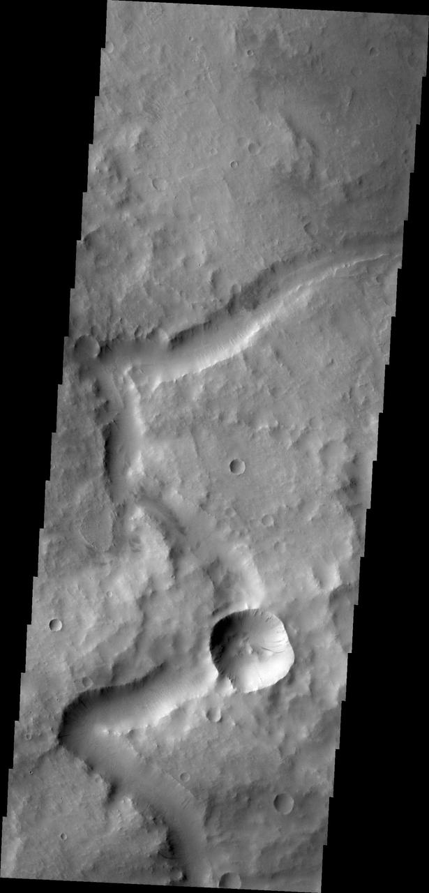 The channel in this image from NASA 2001 Mars Odyssey spacecraft is located in Terra Sabaea. At some time after the channel was carved, the impact event occurred, forever blocking the channel.