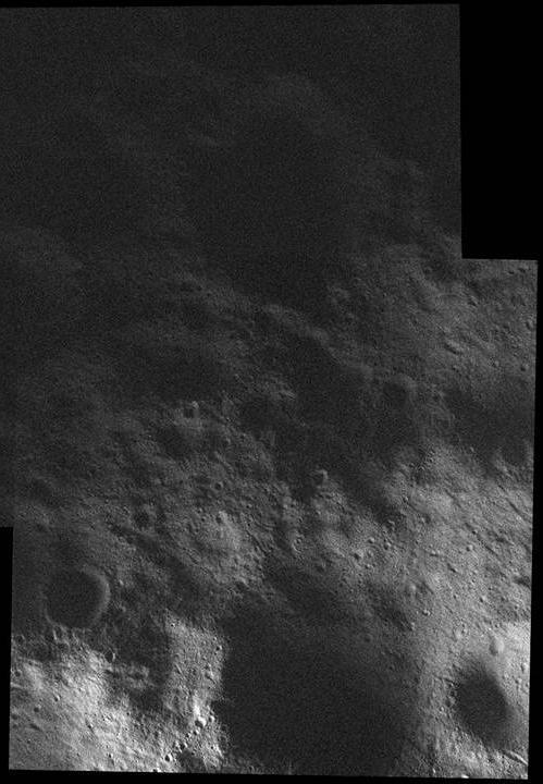 This mosaic of the surface of asteroid Vesta was made from images obtained by NASA Dawn spacecraft while the area was entirely in the sun shadow. Light reflecting off of other areas of Vesta provides the only illumination.