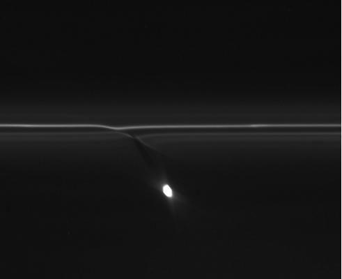 In this image from NASA Cassini spacecraft, the gravitational pull of Saturn moon Prometheus creates patterns in Saturn F ring.