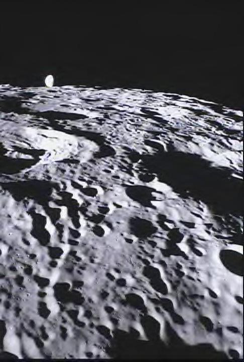 This image of the far side of the lunar surface, with Earth in the background, is of crater De Forest and was taken by NASA MoonKAM system onboard the Ebb spacecraft.