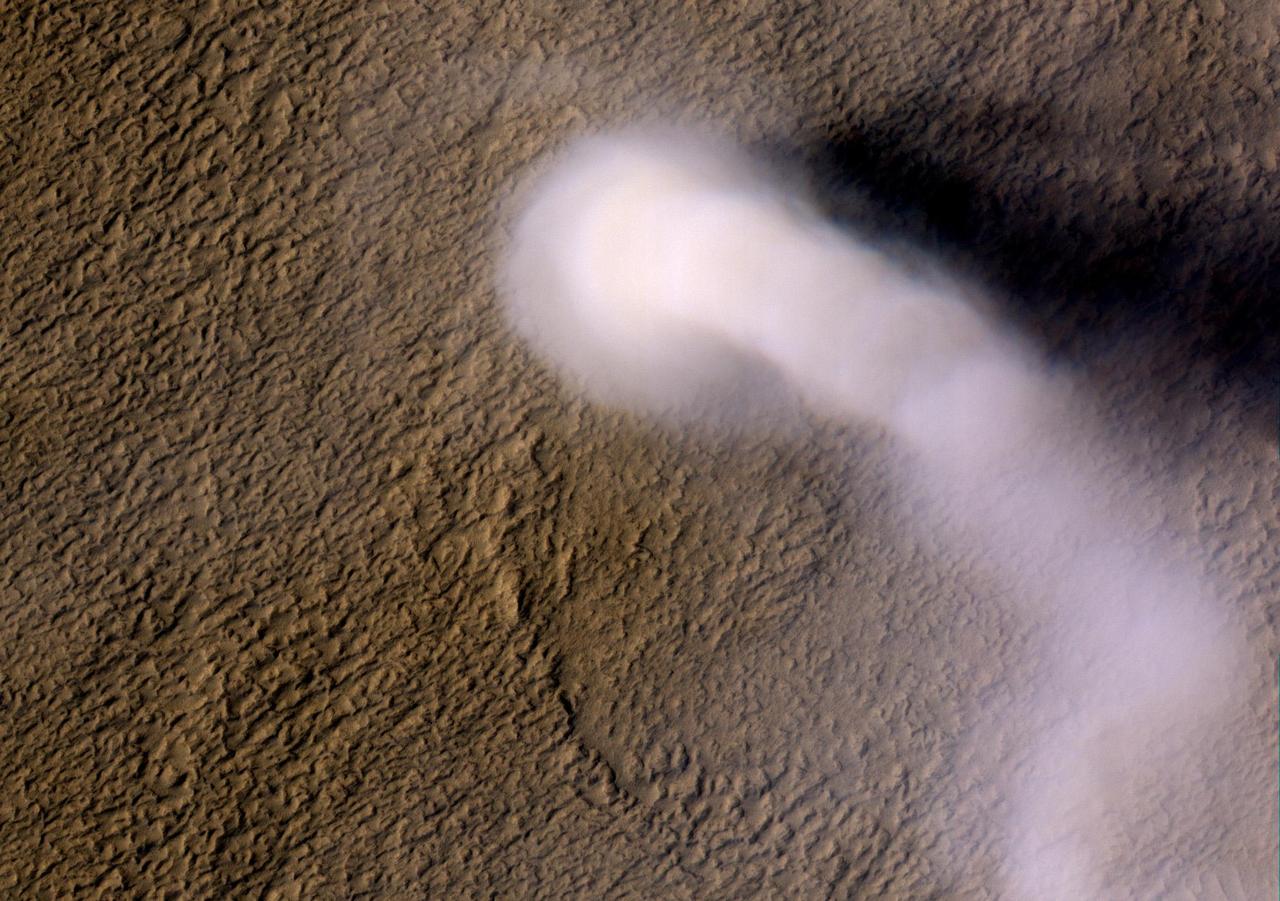 A Martian dust devil was captured winding its way along the Amazonis Planitia region of Northern Mars on March 14, 2012 NASA Mars Reconnaissance Orbiter.