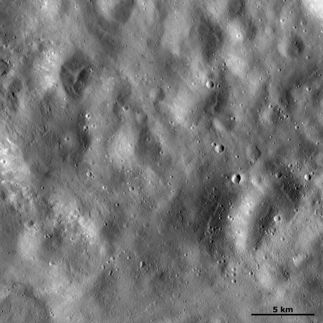 This image of asteroid Vesta from NASA Dawn spacecraft shows a region of the surface that is rather smooth in appearance which is located in Vesta Marcia quadrangle, near the Vestan equator.