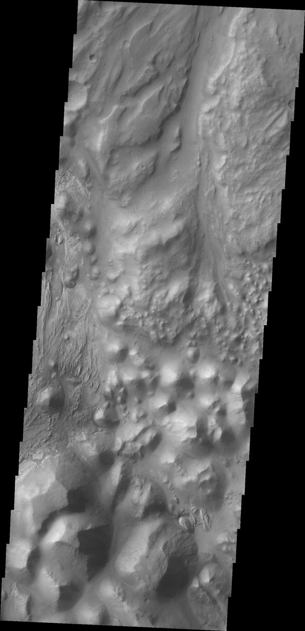 This image captured by NASA 2001 Mars Odyssey spacecraft shows where Ares Vallis starts top of image from Iani Chaos bottom of image.