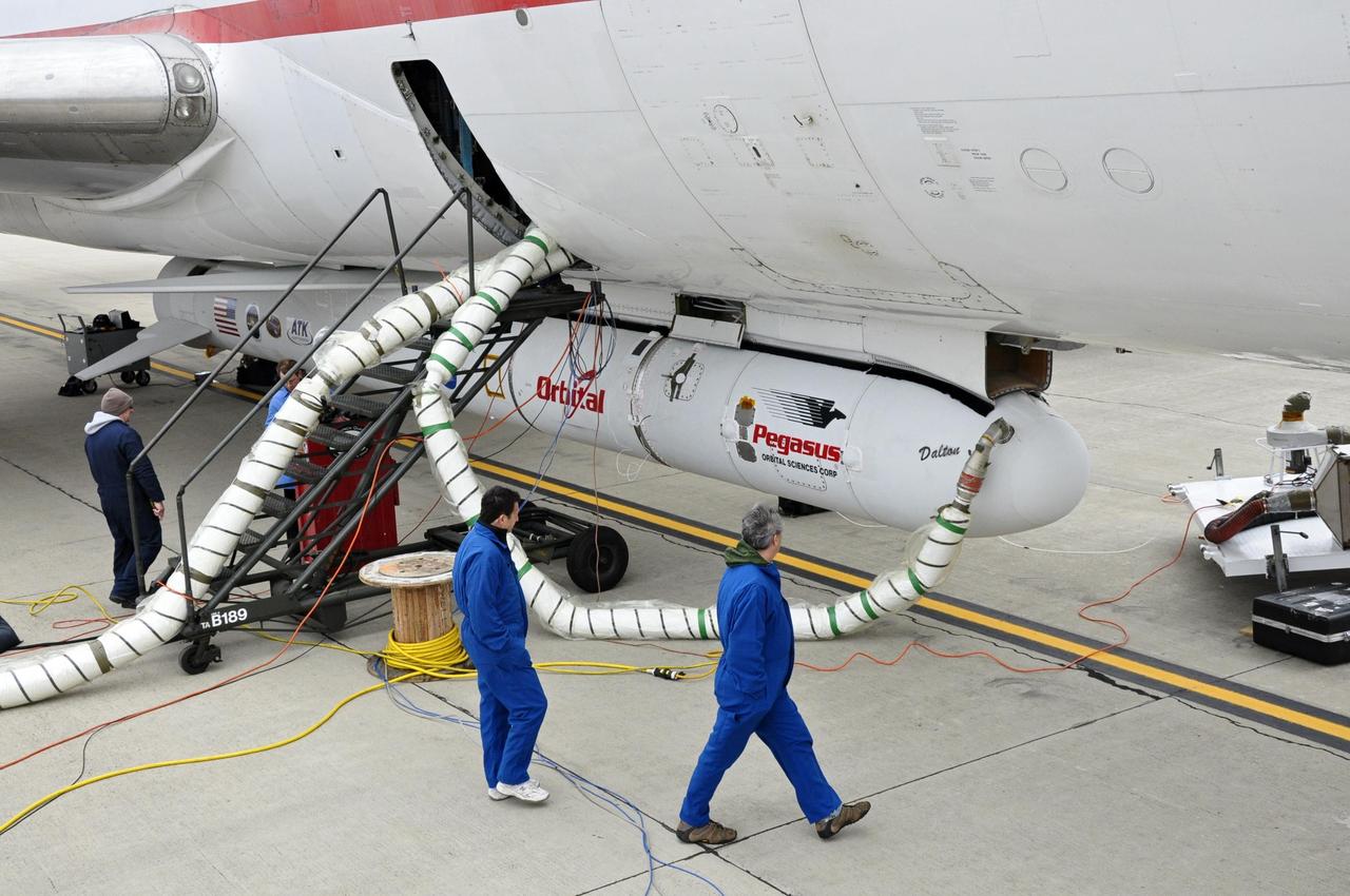 This photo shows the Orbital Sciences Corporation Pegasus XL rocket with NASA NuSTAR spacecraft after attachment to the L-1011 carrier aircraft known as Stargazer.