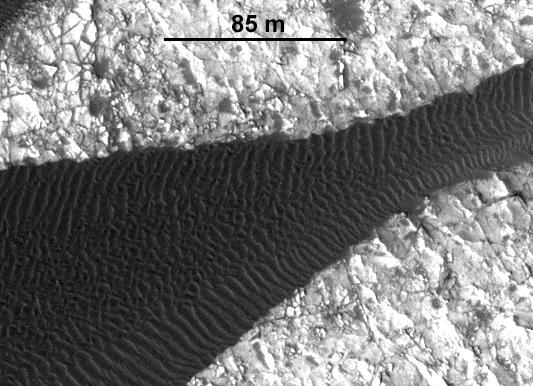 This image, one of two from a two-image animation from NASA Mars Reconnaissance Orbiter, shows movement of ripples covering a sand dune on Mars.