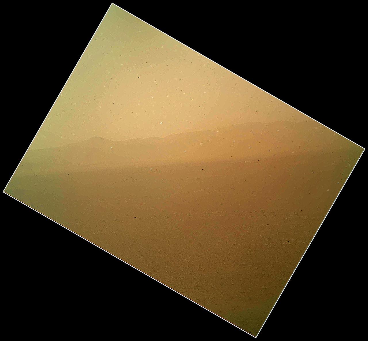 This view of the landscape to the north of NASA Mars rover Curiosity acquired by the Mars Hand Lens Imager on the afternoon of the first day of landing. In the distance, the image shows the north wall and rim of Gale Crater.