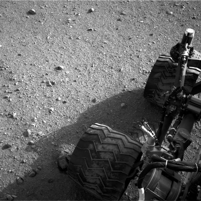 Soil clinging to the right middle and rear wheels of NASA Mars rover Curiosity can be seen in this image taken by the Curiosity Navigation Camera after the rover third drive on Mars.