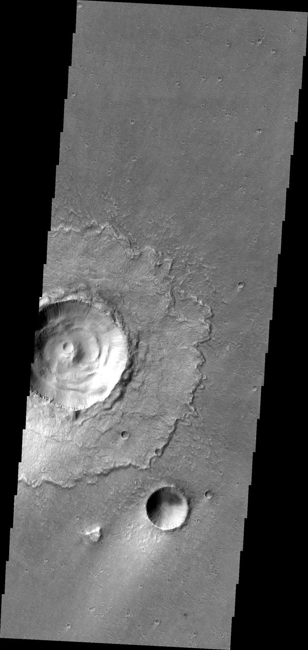 This image from NASA 2001 Mars Odyssey spacecraft is of Lismore Crater. This crater, located in Chryse Planitia, is relatively unmodified, meaning it appears very much like it did when it first formed.