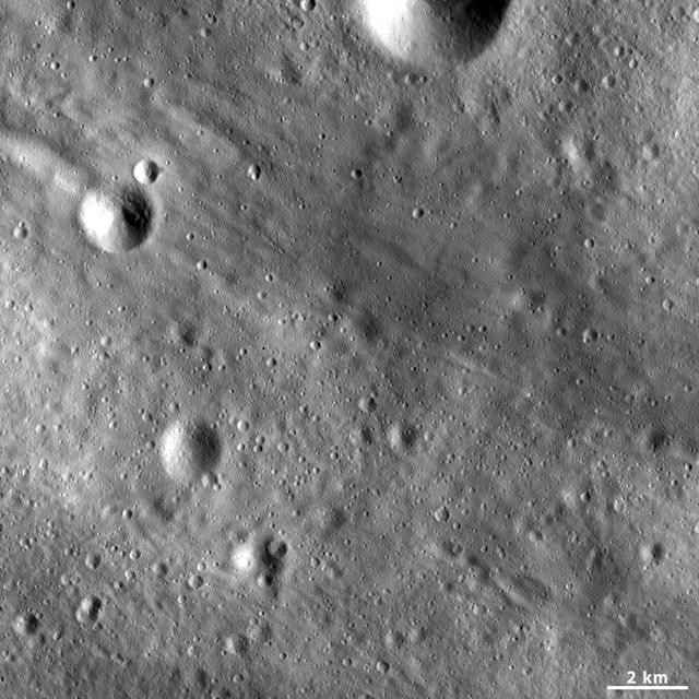 This image from NASA Dawn spacecraft shows linear grooves and ridges in Vesta regolith, located in Vesta Tuccia quadrangle, in asteroid Vesta southern hemisphere.