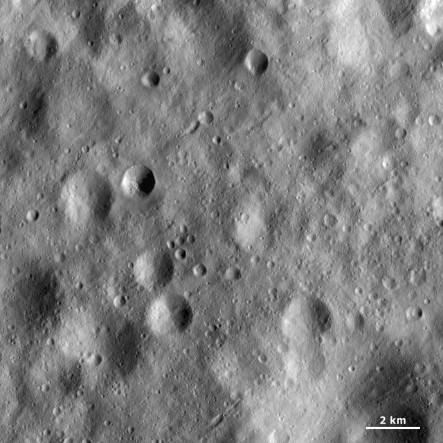 This image from NASA Dawn spacecraft shows a part of asteroid Vesta surface that is covered by heavily cratered regolith. Regolith is the fine-grained material that covers most of Vesta surface.