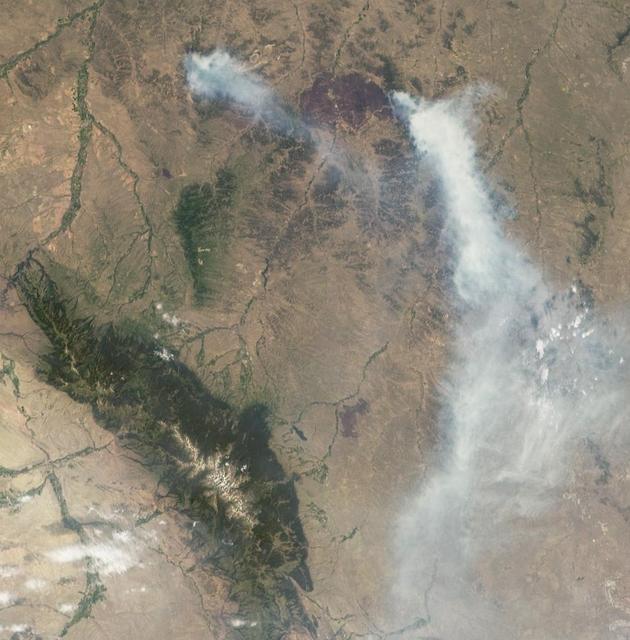 On July 2, 2012, NASA MISR instrument on NASA Terra spacecraft passed over the Horse Creek Fire and much larger Ash Creek Fire Complex in southeastern Montana, to the east of Billings, Mont.